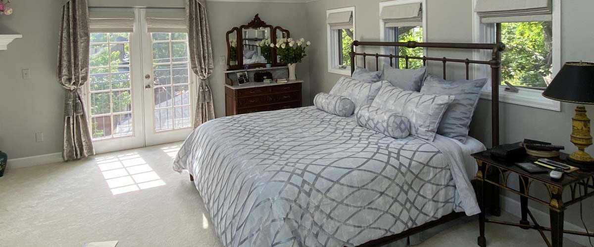 Custom bedding and draperies creating a coordinated bedroom retreat