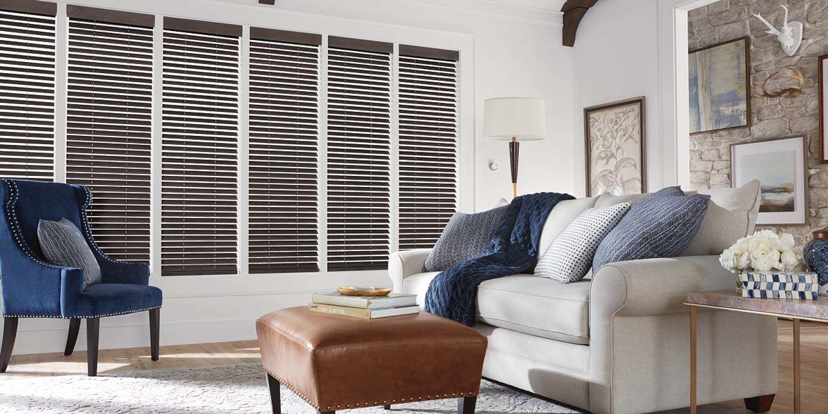 Wood blinds filtering warm natural light across a room