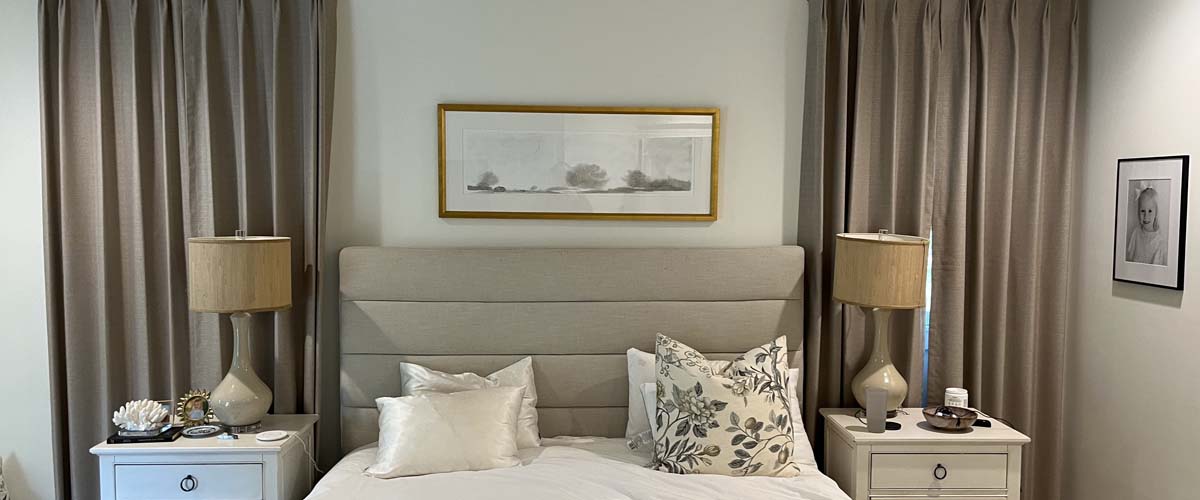 Full-length custom draperies framing a bright window